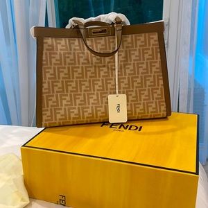 Brand new never used fendi bag.with handles protectors Tags invoice box